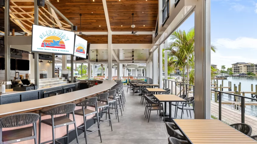 The bar and dining tables at Slipaway Food Truck Park & Marina