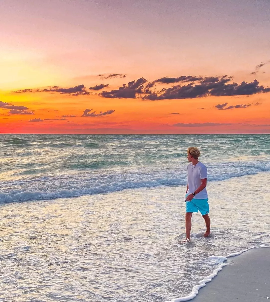man walking at sunset on boca grande
